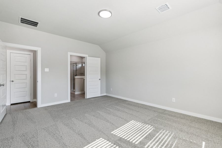 Primary Suite in the Heisman home plan by Trophy Signature Homes – REPRESENTATIVE PHOTO Primary Suite in the Heisman home plan by Trophy Signature Homes – REPRESENTATIVE PHOTO