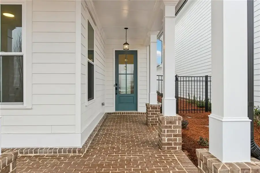 Exterior details and patio area of a home in Promenade at Sawnee Village, Cumming (Image 3).