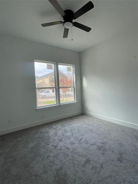 Unfurnished room with carpet flooring and ceiling fan