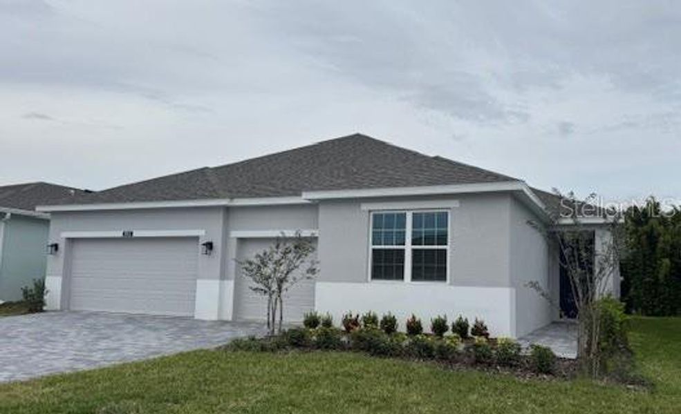 Front exterior of a new home in Storey Creek, Kissimmee, FL, highlighting curb appeal (Image 1). Front exterior of a new home in Storey Creek, Kissimmee, FL, highlighting curb appeal (Image 1).
