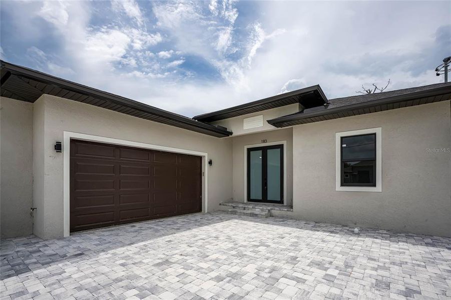 Front exterior of a new home in , Rotonda West, FL, highlighting curb appeal (Image 23).