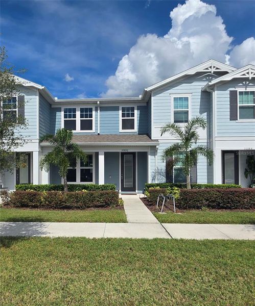 Front exterior of a new home in , Orlando, FL, highlighting curb appeal (Image 13).