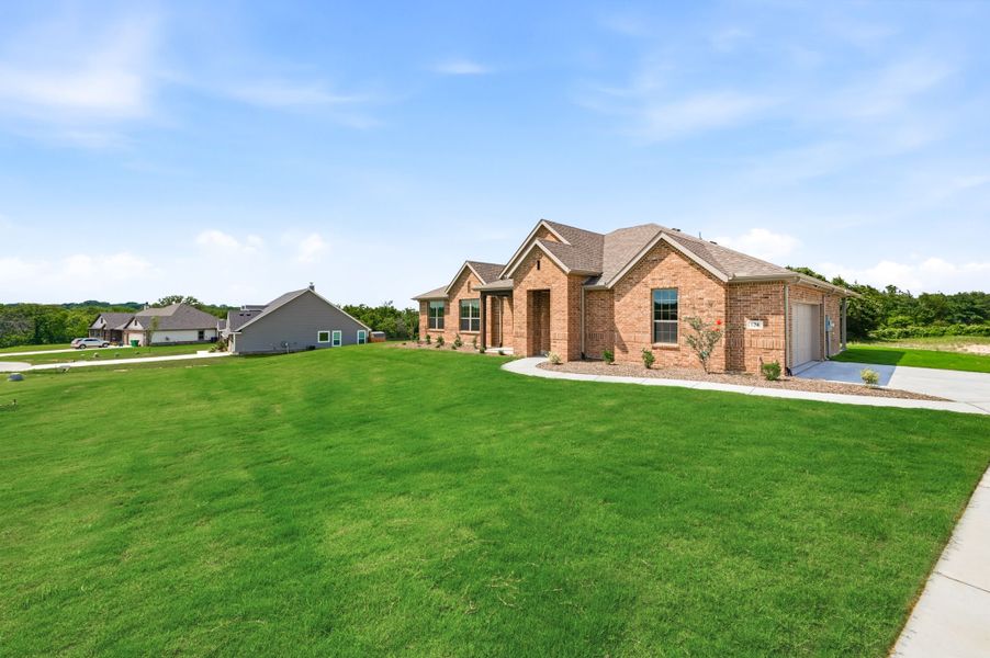 Front exterior of a new home in Saddleback Estates, Boyd, TX, highlighting curb appeal (Image 25).