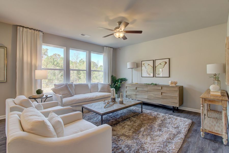 Family room with elevated ceiling height and large windows