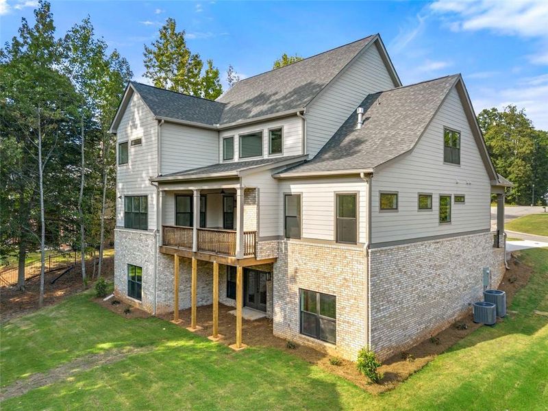 Front exterior of a new home in , Jefferson, GA, highlighting curb appeal (Image 1).