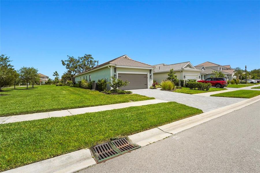 Front exterior of a new home in , Sarasota, FL, highlighting curb appeal (Image 26).