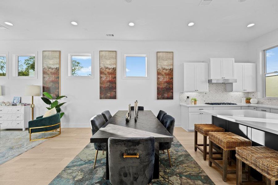 Dining room featuring recessed lighting and light wood finished floors