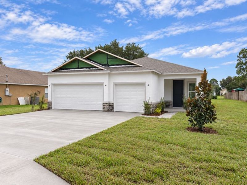 Front exterior of a new home in Palm Coast, Palm Coast, FL, highlighting curb appeal (Image 11).