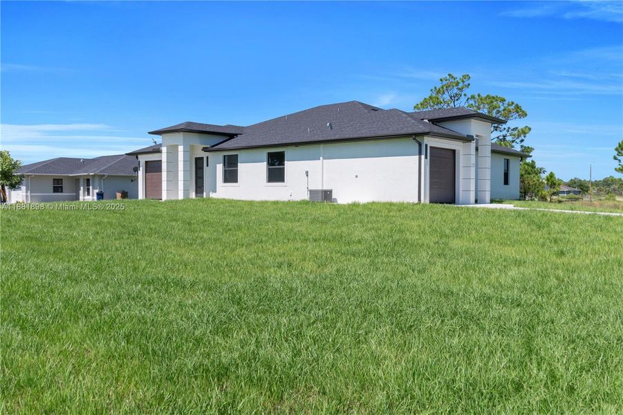 Front exterior of a new home in , Lehigh Acres, FL, highlighting curb appeal (Image 24).