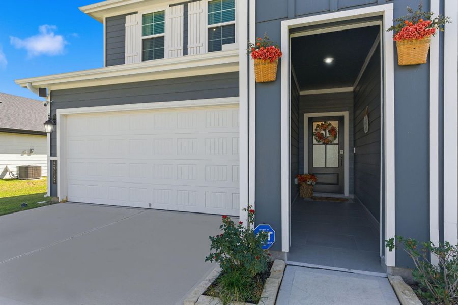 Recently tiled entryway sets the tone for the cozy and inviting design throughout. Recently tiled entryway sets the tone for the cozy and inviting design throughout.