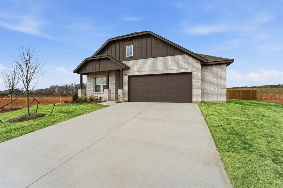 Front exterior of a new home in Saddlebrook Estates, Waxahachie, TX, highlighting curb appeal (Image 17).