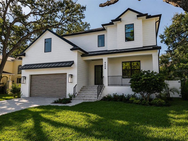 Front exterior of a new home in , Tampa, FL, highlighting curb appeal (Image 1). Front exterior of a new home in , Tampa, FL, highlighting curb appeal (Image 1).