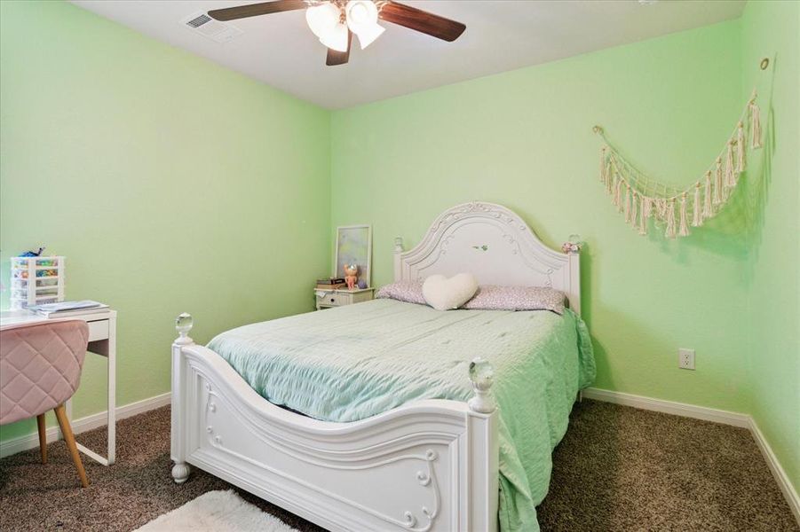 Bedroom featuring carpet flooring and ceiling fan Bedroom featuring carpet flooring and ceiling fan
