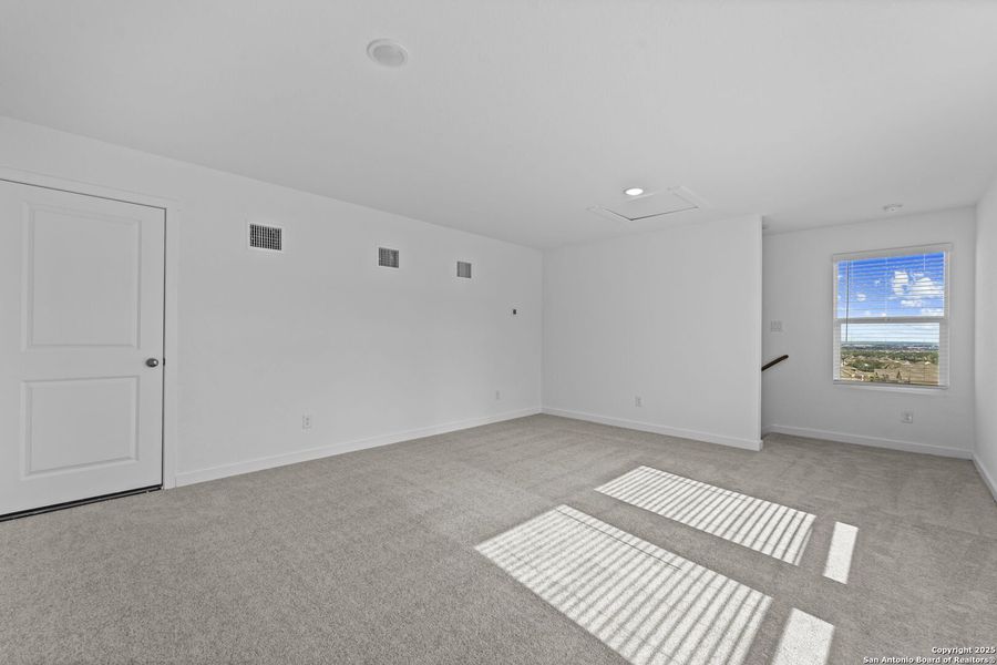 Spacious, unfurnished interior of a new home in Waterwheel: Coastline Collection, San Antonio (Image 13).