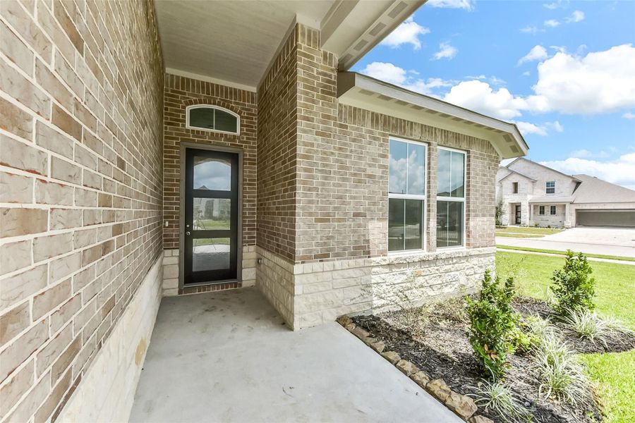 Front exterior of a new home in Sierra Vista, Rosharon, TX, highlighting curb appeal (Image 19).