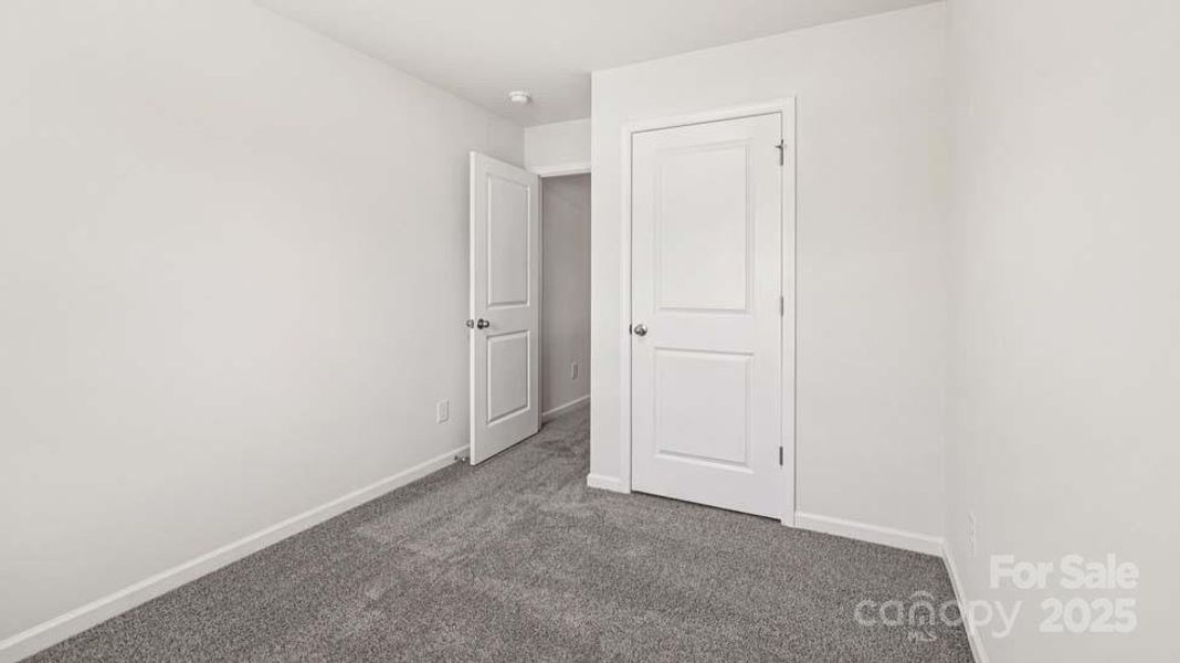 Spacious, unfurnished interior of a new home in Mallard Creek Townhomes, Charlotte (Image 19). Spacious, unfurnished interior of a new home in Mallard Creek Townhomes, Charlotte (Image 19).