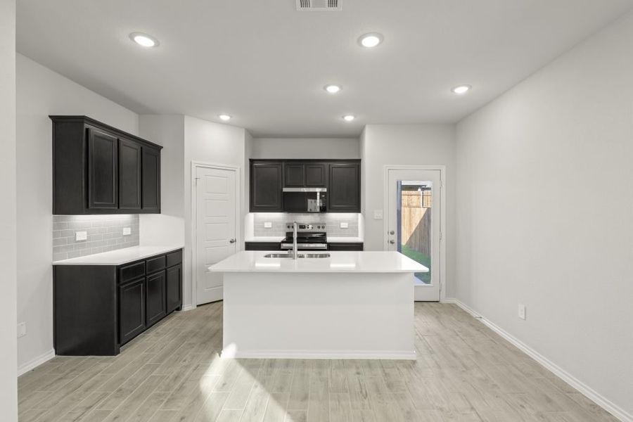 Representative furnished interior of a home built from the Birch by Impression Homes in Churchill, Anna (Image 6).