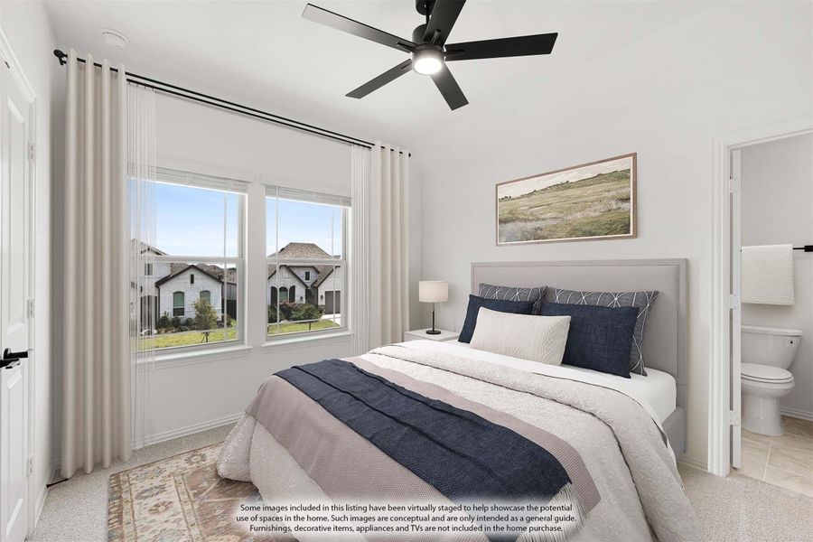 Bedroom with ceiling fan, large windows, and ensuite bathroom access Bedroom with ceiling fan, large windows, and ensuite bathroom access