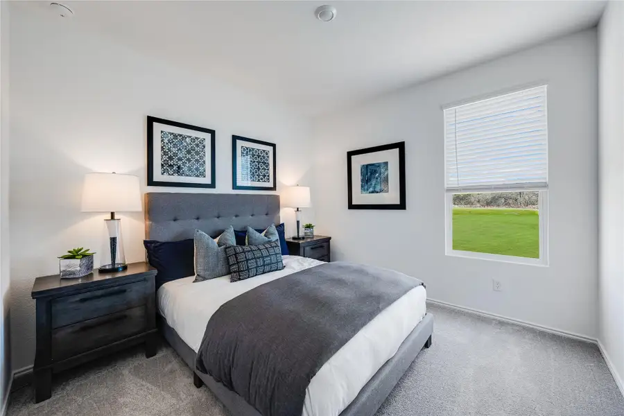 Bedroom with carpet and baseboards