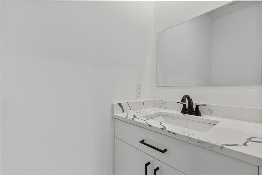 Bathroom featuring vanity Bathroom featuring vanity
