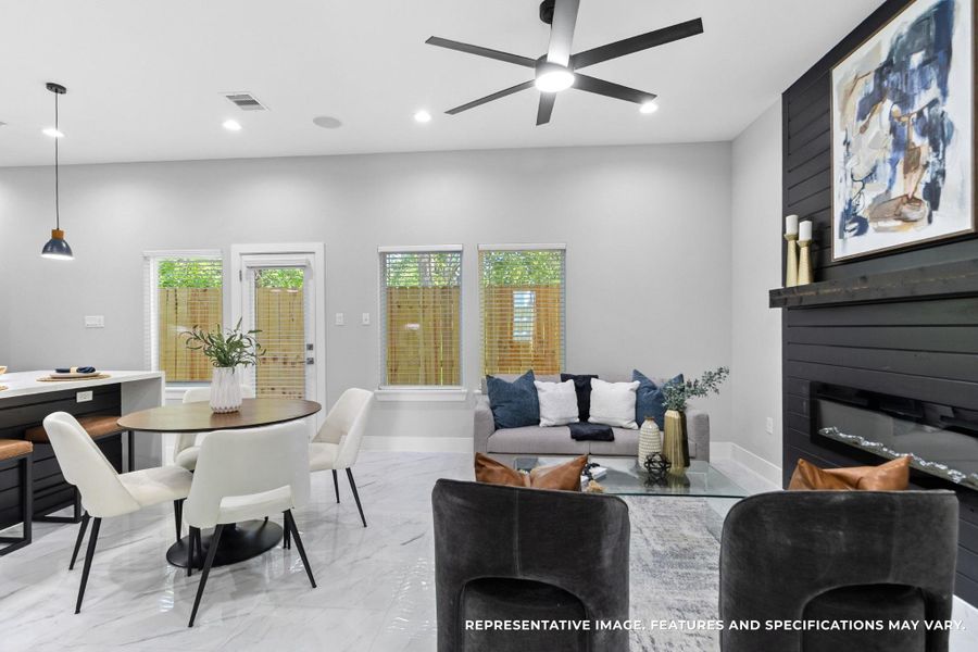 Morning coffee at your round table feels easy here, sunlight streaming in through the windows while the open flow keeps you connected to the living room and kitchen.