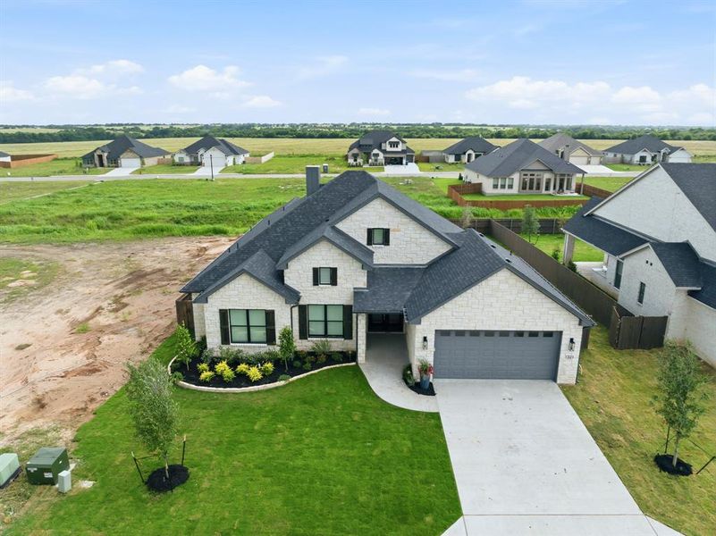 Front exterior of a new home in , Hewitt, TX, highlighting curb appeal (Image 19).
