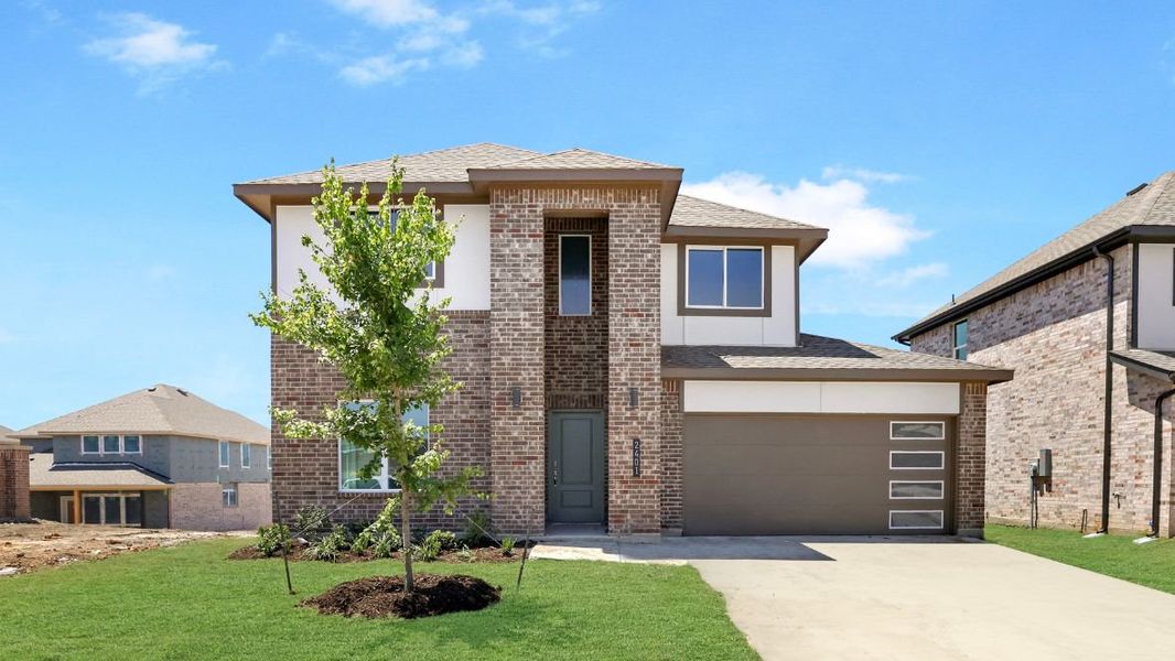 Representative exterior photo of a completed home built from the TANGERINE by D.R. Horton in The Preserve at Forum, Grand Prairie, TX (Image 1).