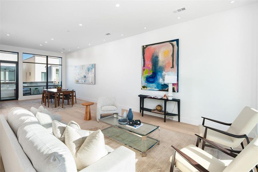 Living room with light hardwood / wood-style floors