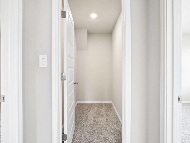 Corridor with carpet floors, baseboards, and recessed lighting Corridor with carpet floors, baseboards, and recessed lighting