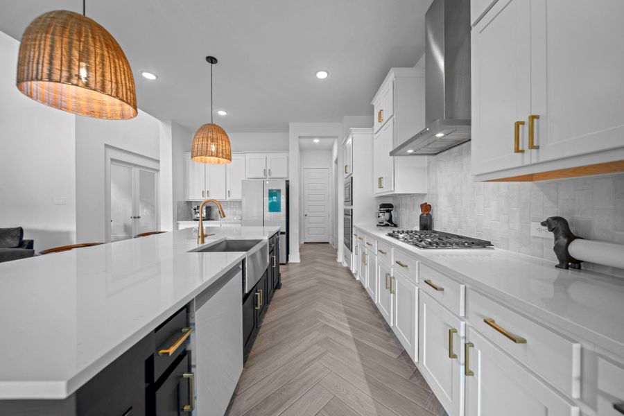 Expansive counter space, touchless faucet, gas cooktop, make this kitchen highly functional. A blend of clean design and everyday convenience. Expansive counter space, touchless faucet, gas cooktop, make this kitchen highly functional. A blend of clean design and everyday convenience.