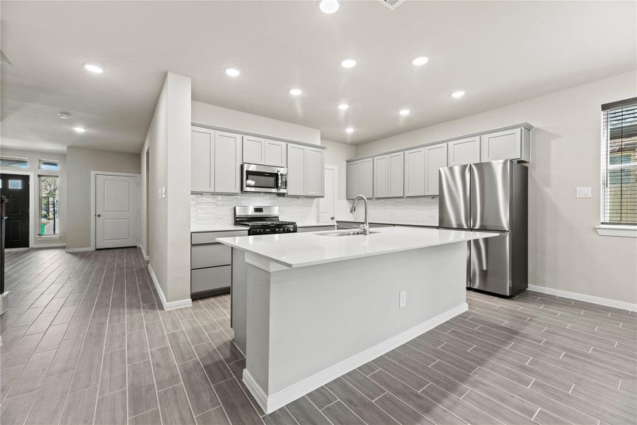 Large kitchen island makes perfect space to entertain.