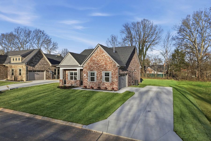 Front exterior of a new home in Sagewood, Tullahoma, TN, highlighting curb appeal (Image 22).