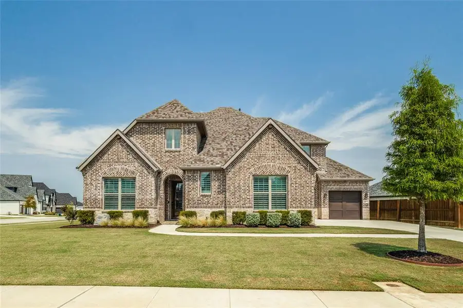 Front exterior of a new home in , Flower Mound, TX, highlighting curb appeal (Image 1).