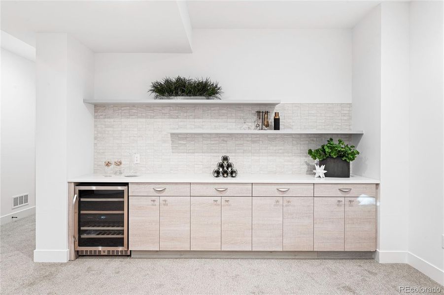 Beverage cooler and storage in lower level family room