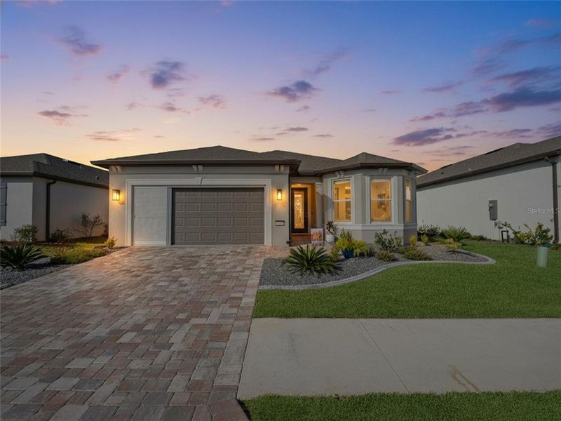 Front exterior of a new home in Del Webb Stone Creek, Ocala, FL, highlighting curb appeal (Image 20).