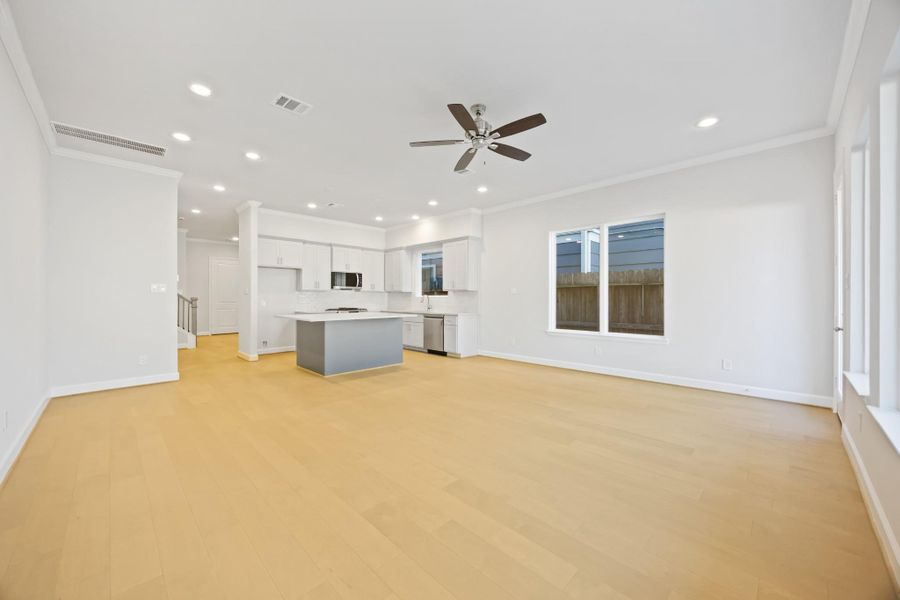 The kitchen's open design seamlessly transitions into the spacious living room, affirming the beauty of an interconnected living space. The kitchen's open design seamlessly transitions into the spacious living room, affirming the beauty of an interconnected living space.