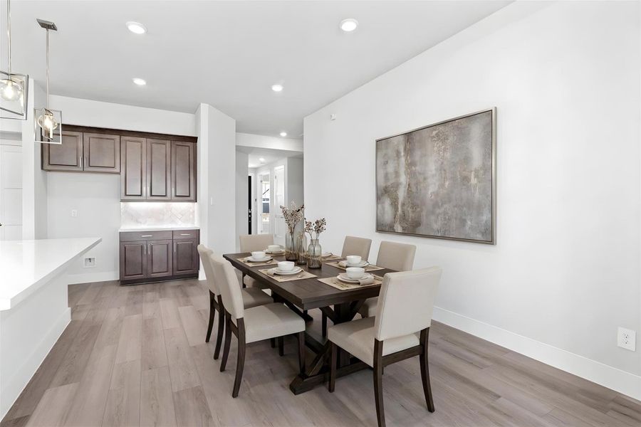 This dining area is a natural extension of the kitchen and living room, allowing for seamless conversation and connection with guests or family members, even when preparing a meal. *Virtually Staged This dining area is a natural extension of the kitchen and living room, allowing for seamless conversation and connection with guests or family members, even when preparing a meal. *Virtually Staged