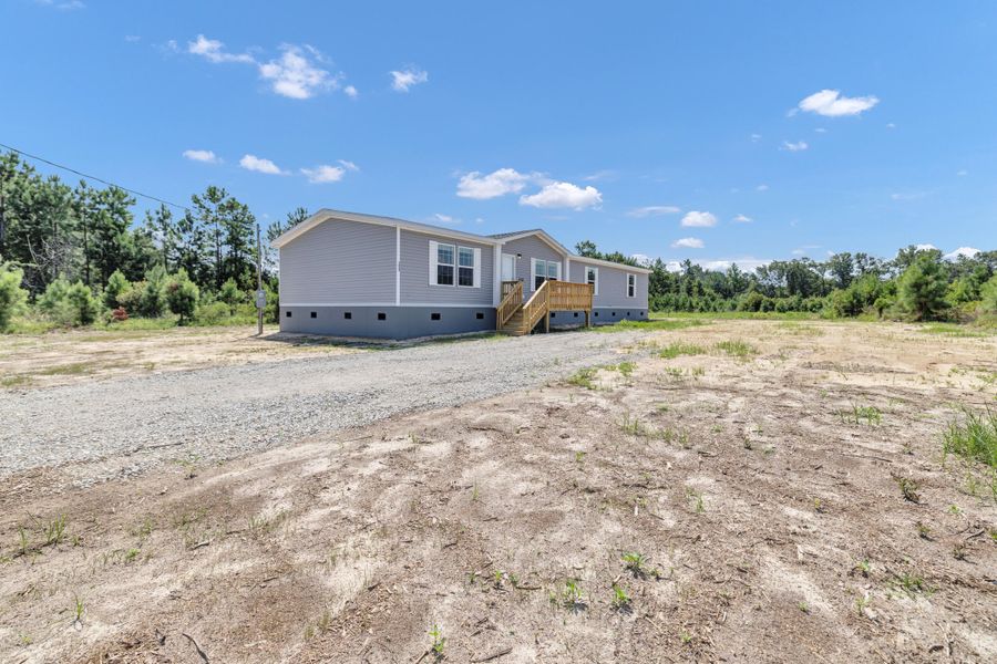 Front exterior of a new home in , Cross, SC, highlighting curb appeal (Image 23).