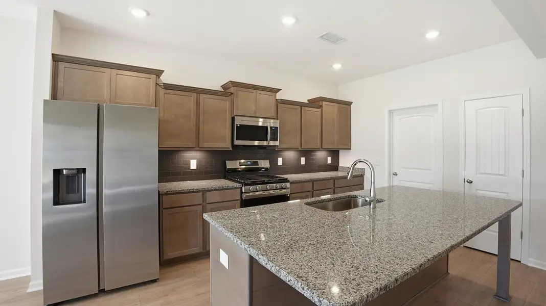 the door closes to the kitchen wall is the laundry room that enters into the garage. the door to the right is pantry #2. There is another pantry in the laundry room the door closes to the kitchen wall is the laundry room that enters into the garage. the door to the right is pantry #2. There is another pantry in the laundry room