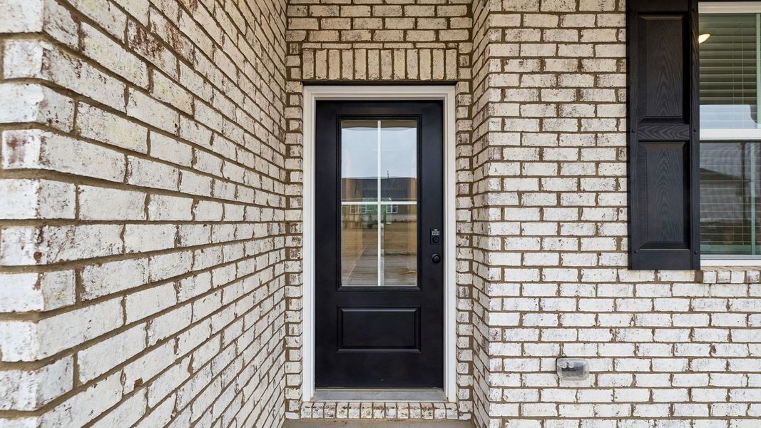 Exterior details and patio area of a home in Harvest Point, Spring Hill (Image 24).