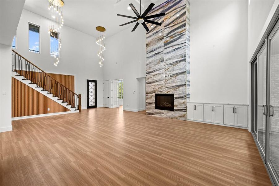 Floor to ceiling tiled fireplace in this vaulted ceiling living room.