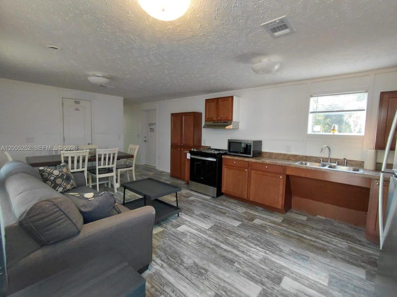 Furnished interior view inside a new home in , Clewiston (Image 3).