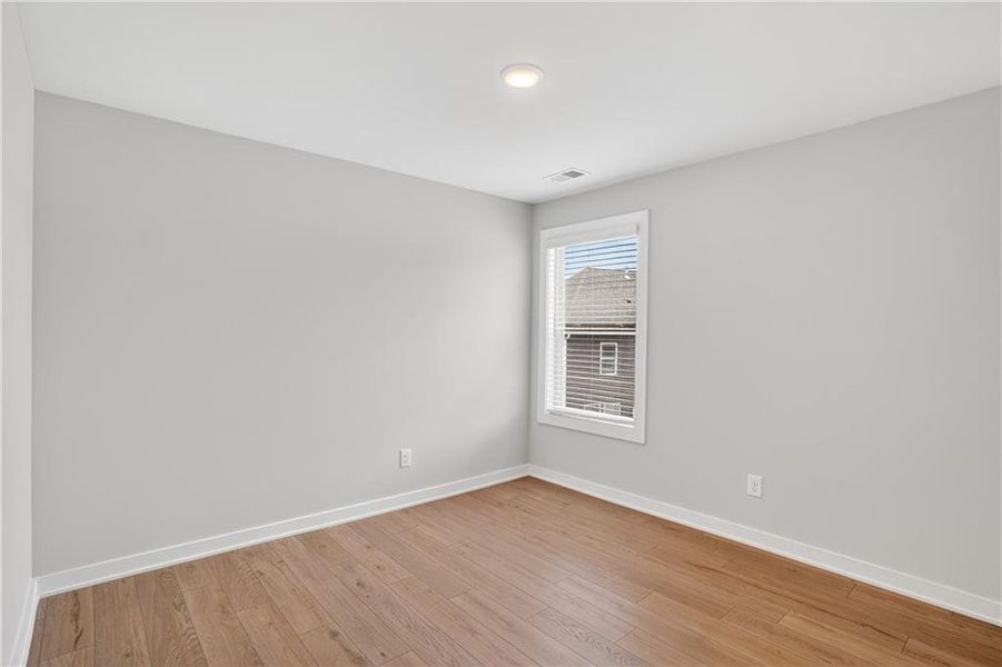 Spacious, unfurnished interior of a new home in The Fairways at Mirror Lake, Villa Rica (Image 29).