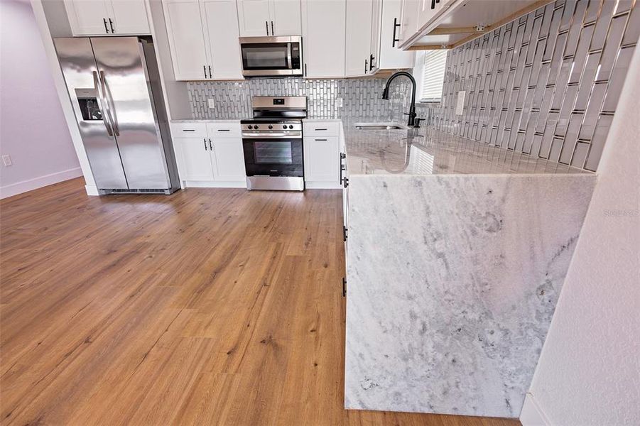 Glimpse of the kitchen from the dining area Glimpse of the kitchen from the dining area