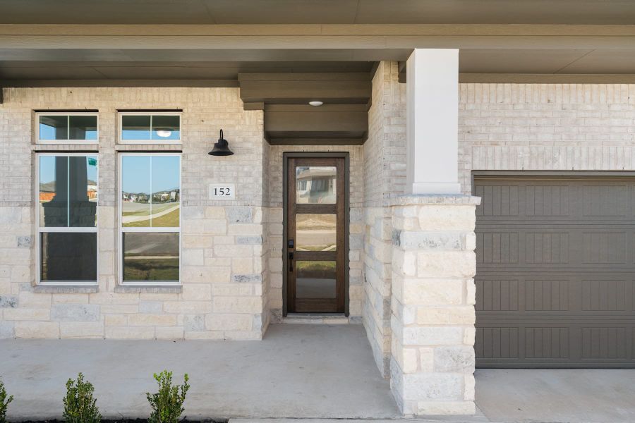 Exterior details and patio area of a home in Lariat, Liberty Hill (Image 3).