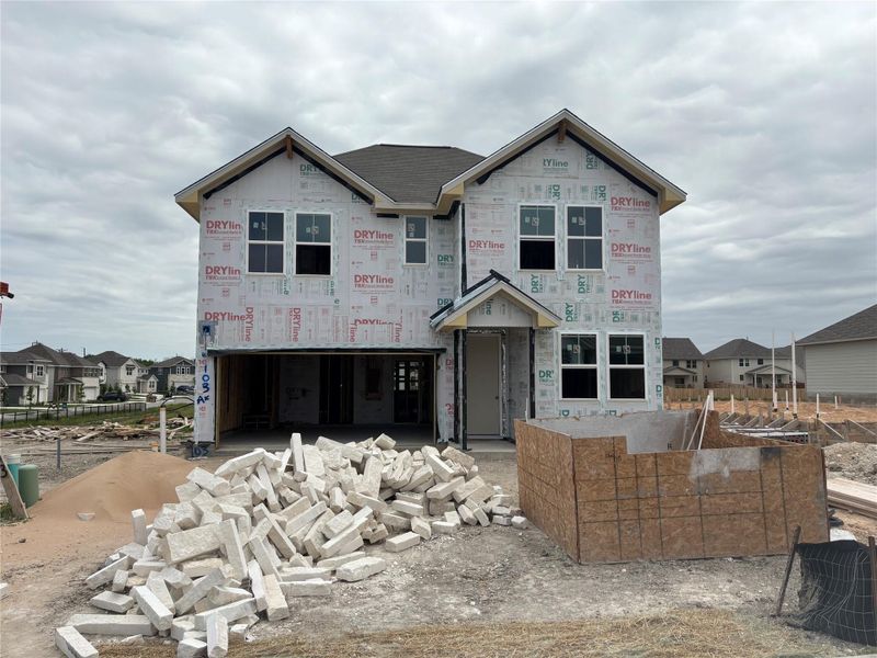 Front exterior of a new home in Covered Bridge, Hutto, TX, highlighting curb appeal (Image 2).
