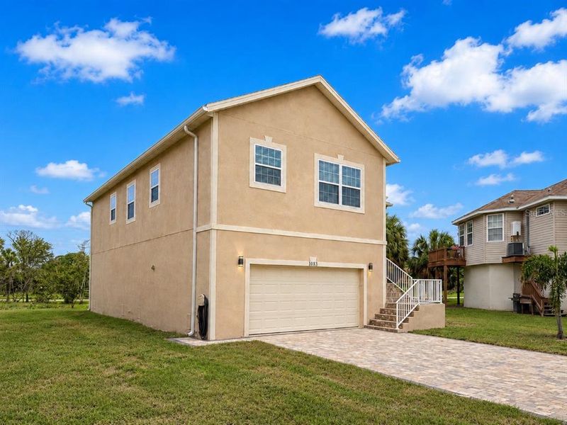 Front exterior of a new home in , Tarpon Springs, FL, highlighting curb appeal (Image 25). Front exterior of a new home in , Tarpon Springs, FL, highlighting curb appeal (Image 25).
