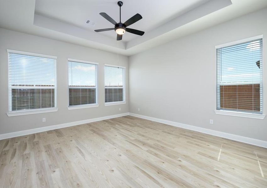 You will love ending your day in the master bedroom with its gorgeous flooring and large windows.