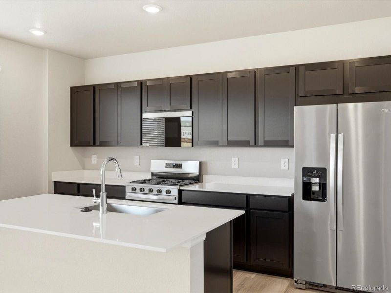 Furnished interior view inside a new home in Buffalo Highlands: The Flora Collection, Commerce City (Image 6).