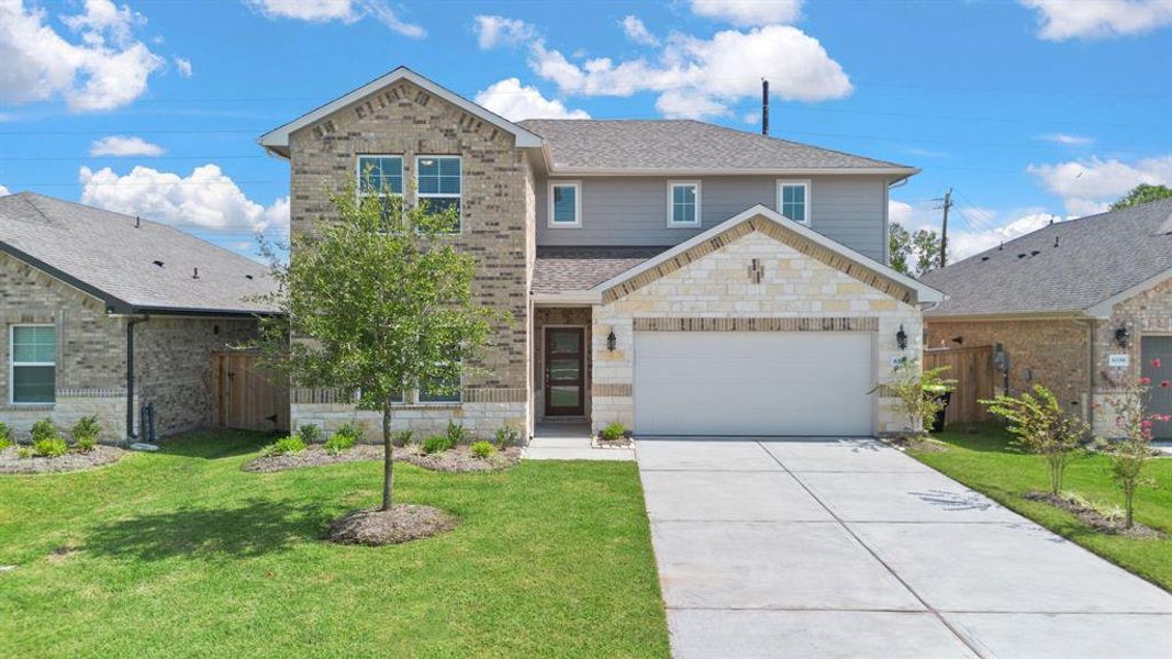 Upon arrival to this STUNNING home, elegance greets you prior to entry with a welcoming walkway to the private front entryway, beautiful brick & stone elevation and abundance of greenspace.